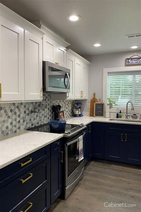 navy blue cabinets with backsplash.